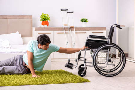 Young handsome disabled man recovering at homeの写真素材