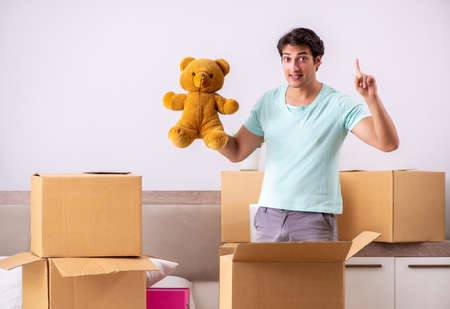 Young man moving to new apartment