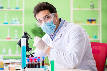Man chemist working in the lab