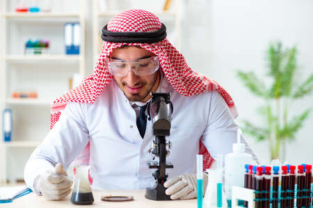 Arab chemist scientist testing quality of oil petrolの写真素材