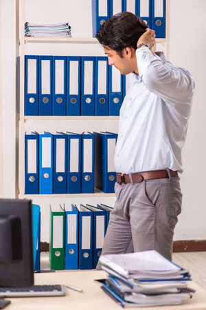 Young male employee working in the officeの写真素材