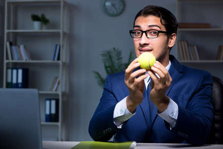 Young employee with tennis ballの写真素材