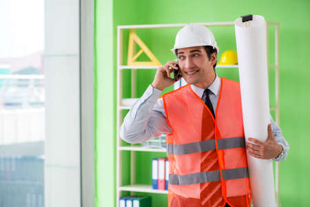 A male architect working on the project
