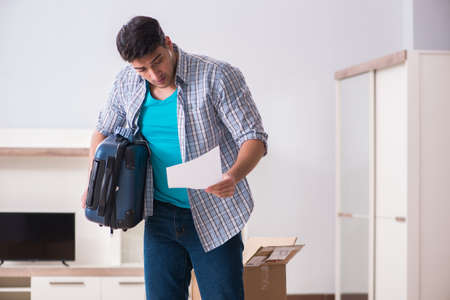 Unemployed man receiving foreclosure notice letterの写真素材