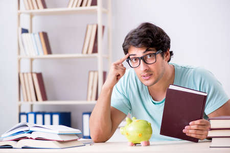 Young student in expensive tuition conceptの写真素材