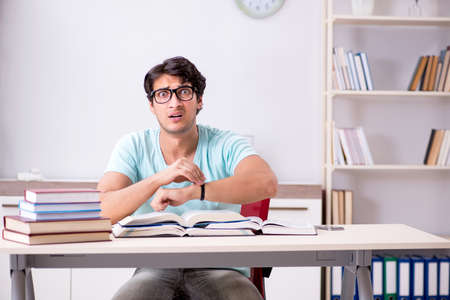 Young handsome student preparing for school examsの写真素材