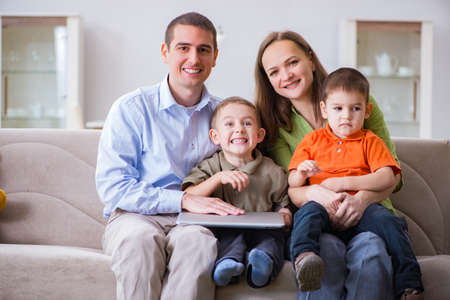 Young family surfing internet and looking at photos