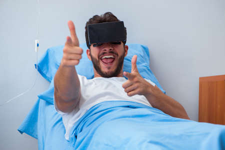 Patient in the hospital with VR glasses headset