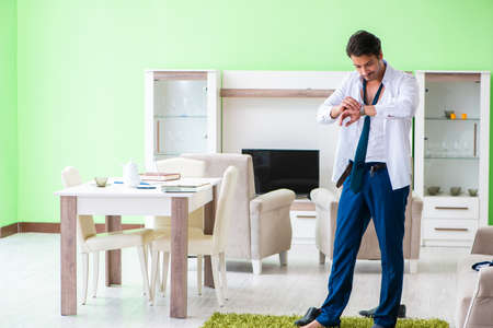 Man dressing up and late for workの写真素材