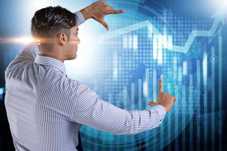 BUsinessman pressing virtual button on diagram chart