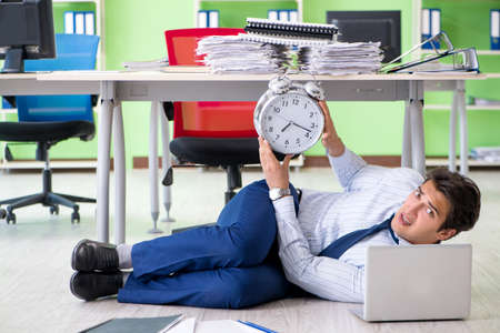 Frustrated businessman stressed from excessive workの写真素材