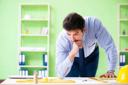 Young male architect working at the projectの写真素材