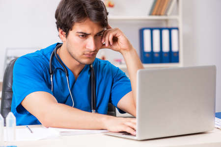 Young doctor working in the hospitalの写真素材