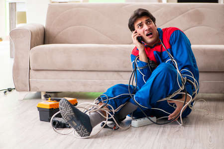 Electrician contractor with tangled cablesの写真素材