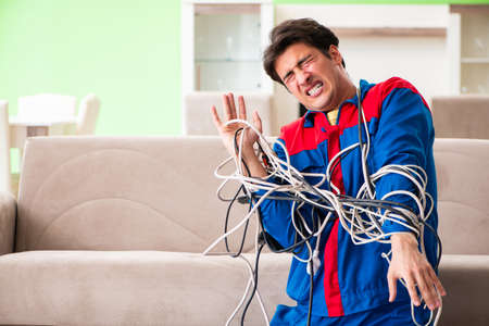 Electrician contractor with tangled cables