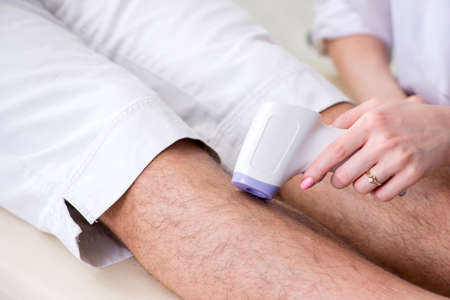 Young man visiting doctor for epilation