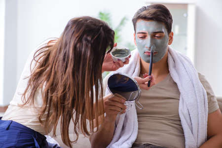 Handsome applying clay mask on faceの写真素材