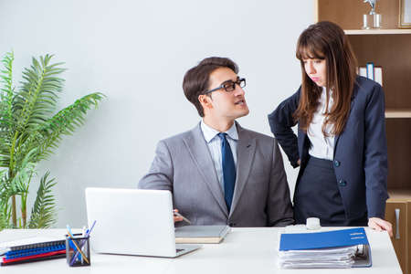 Boss and secretary in the officeの写真素材