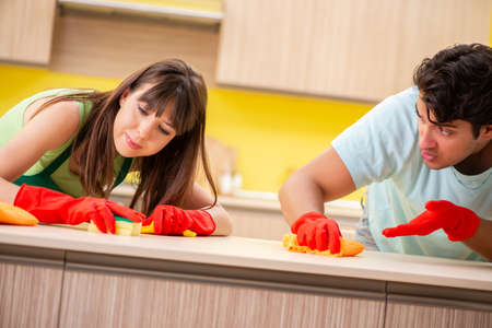 Young couple working at kitchen