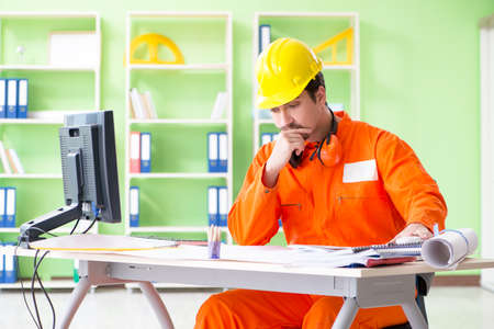 Construction supervisor planning new project in office