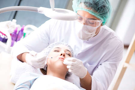 Woman visiting doctor for plastic surgeryの写真素材