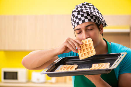 Man cook preparing cake in kitchen at homeの写真素材