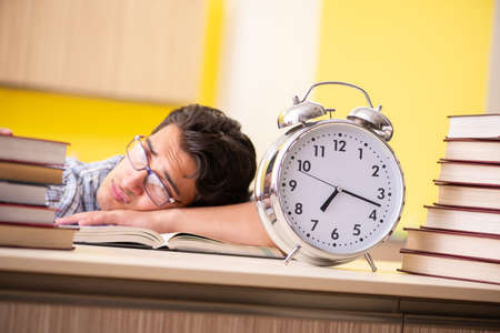 Student preparing for exam sitting at the kitchenの写真素材