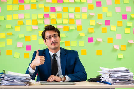 Businessman having trouble with his prioritiesの写真素材