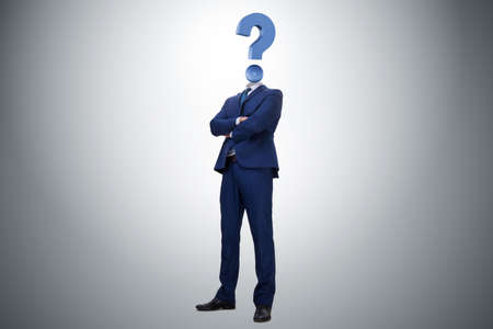 Businessman with question mark instead of his headの写真素材