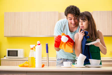 Young couple working at kitchenの写真素材