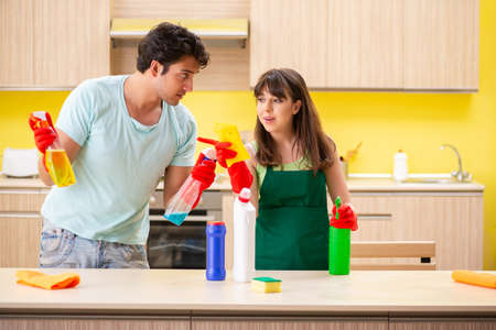Young couple working at kitchen