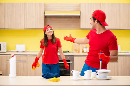 Cleaning professional contractors working at kitchen
