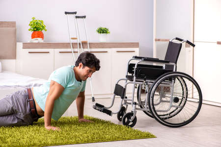 Young handsome disabled man recovering at home
