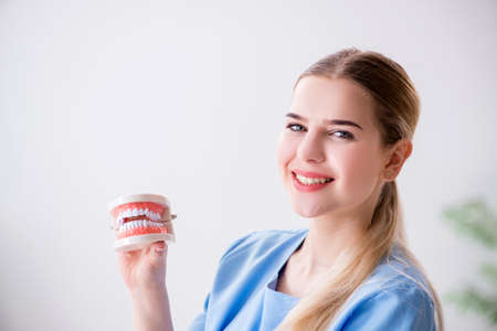Young doctor nurse with dentures