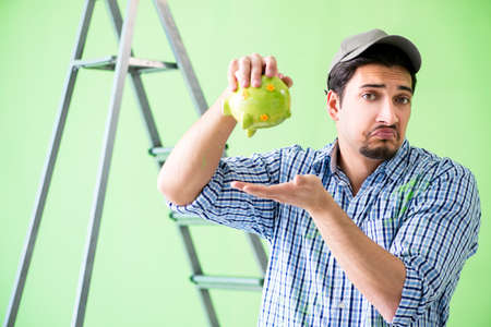 Young painter doing renovation at homeの写真素材