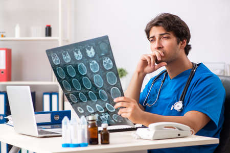 Male doctor radiologist with x-ray can image