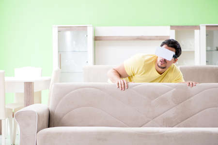 Young man with virtual reality gogglesの写真素材