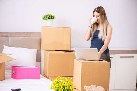 Young woman moving to new place