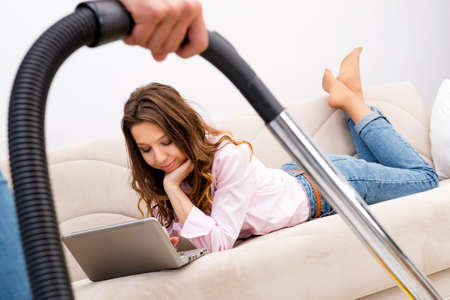 Young family doing cleaning at homeの写真素材