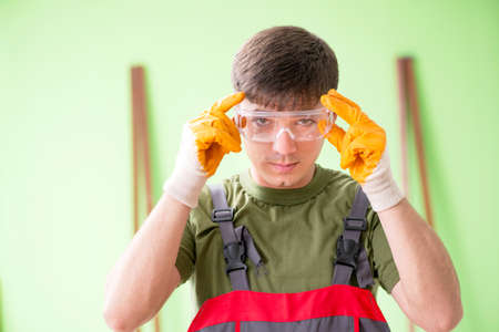 Young man carpenter working in workshopの写真素材