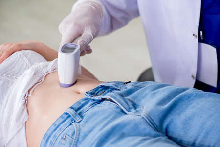 Pregnant woman visiting radiologyst for ultrasoundの写真素材