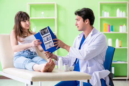 Pregnant woman visiting radiologyst for ultrasoundの写真素材