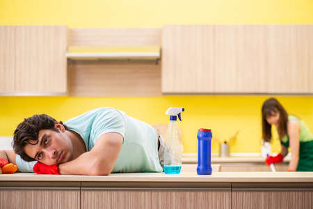 Young couple working at kitchenの写真素材