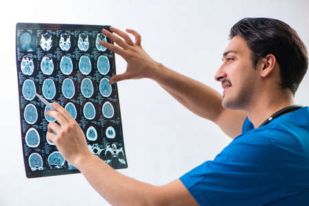 Young handsome doctor radiologyst working in hospital