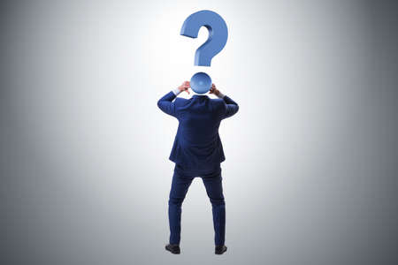 Businessman with question mark instead of his headの写真素材