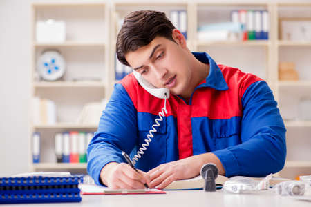 Worker in uniform working on project