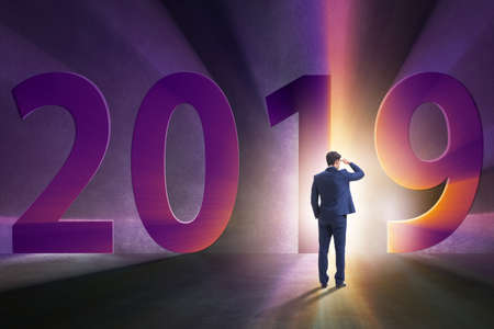 Businessman in the concept of transition to year 2019