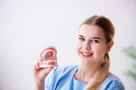 Young doctor nurse with dentures