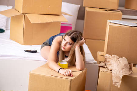 Young woman moving to new place