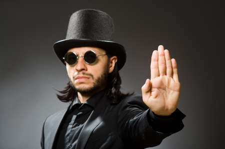 Vintage concept with man wearing black top hat